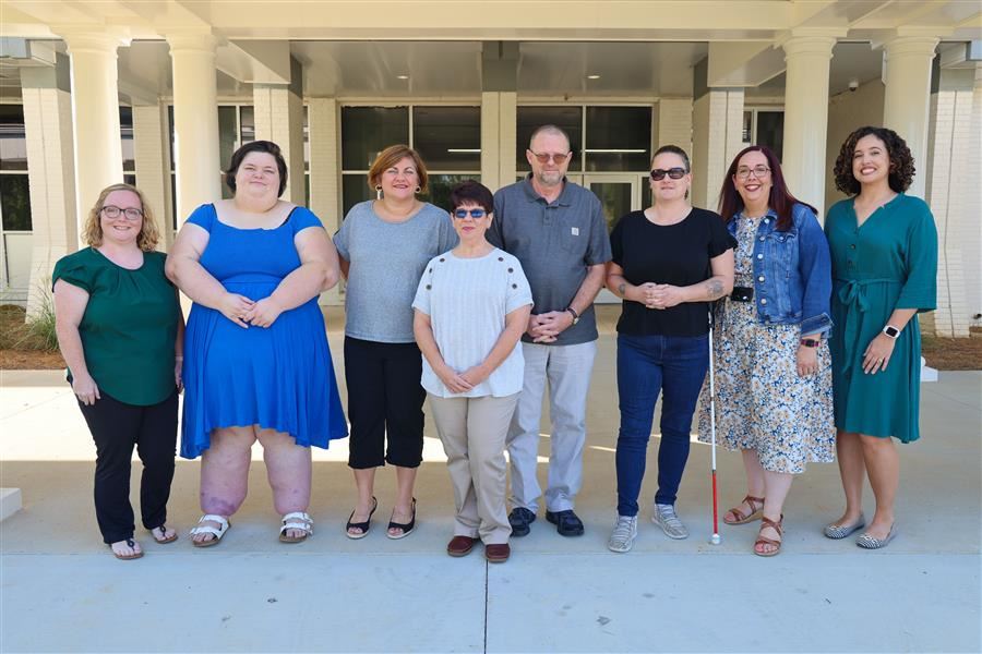 Short-Term Programs staff standing in front of building for a group photo. Short-Term Programs staff standing in front of building for a group photo.